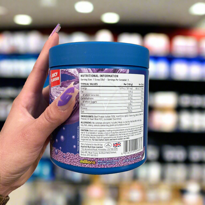 Close-up of (Applied Nutrition Beef-XP 150g) held up inside My Supplement Shop, clearly showing key ingredients on the packaging in a Sports Nutrition setting.