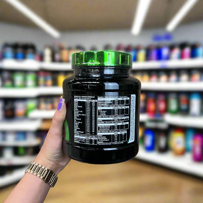 Close-up of (SciTec Multi Pro Plus - 30 packets) held up inside My Supplement Shop, clearly showing Nutritional Values on the packaging in a Sports Nutrition setting.